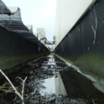 The internal gutters had leaks causing extensive damage below. As well as damage repairs, the gutter was re-formed with slope which included removing roofing.